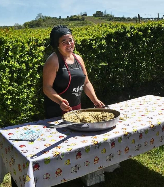 Dona preparing traditional Tuscan food at A Casa di Dona near San Gimignano
